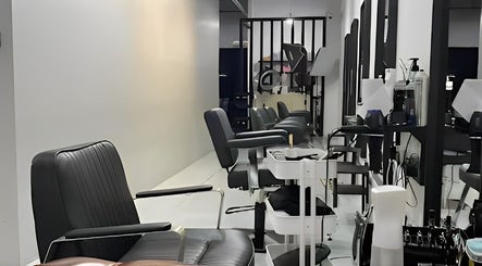 Modern salon chairs at Dee Kar Hair Salon, Cyberjaya, Selangor, MY showcasing sleek design and comfort.