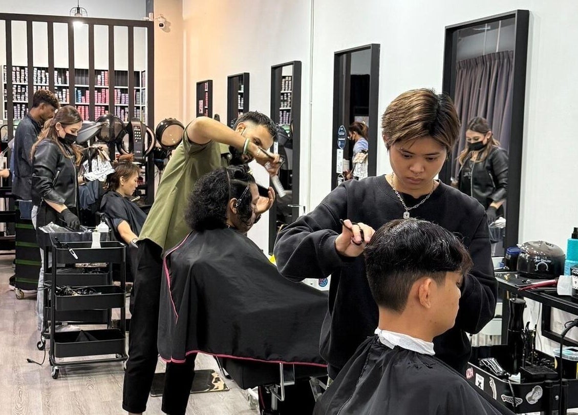 Stylists at work in Dee Kar Hair Salon, Cyberjaya, Selangor, MY, providing expert hair services.