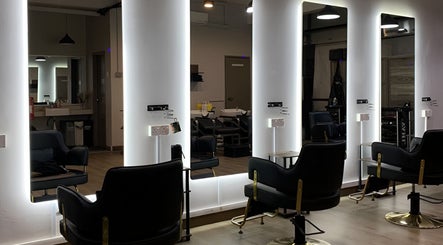 Modern interior of Dee Kar Hair Salon (Lgk) with sleek chairs and illuminated mirrors in Langkawi, Kedah, MY.