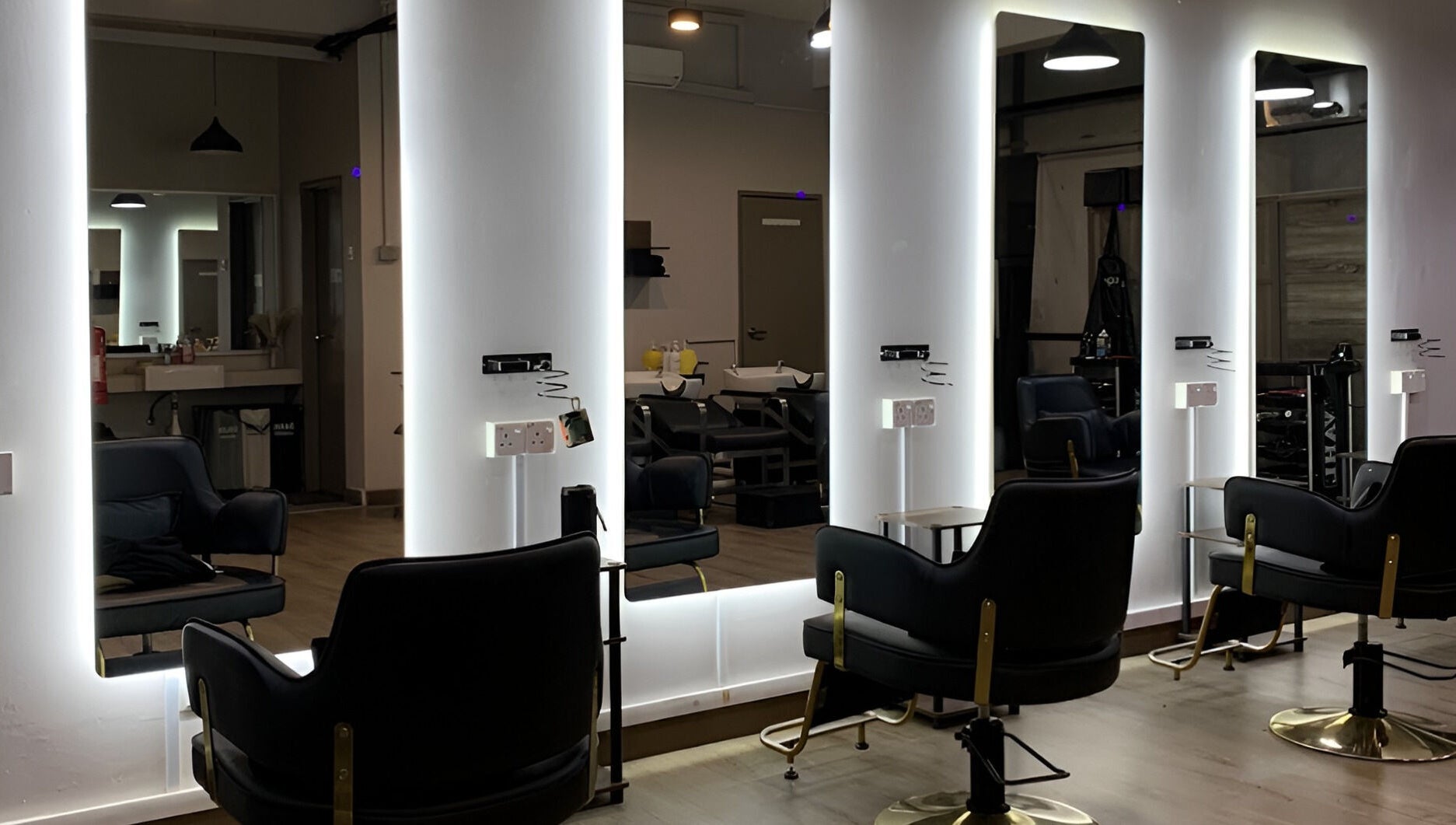 Modern styling chairs in Dee Kar Hair Salon (Lgk), Langkawi, Kedah, MY with illuminated mirrors.