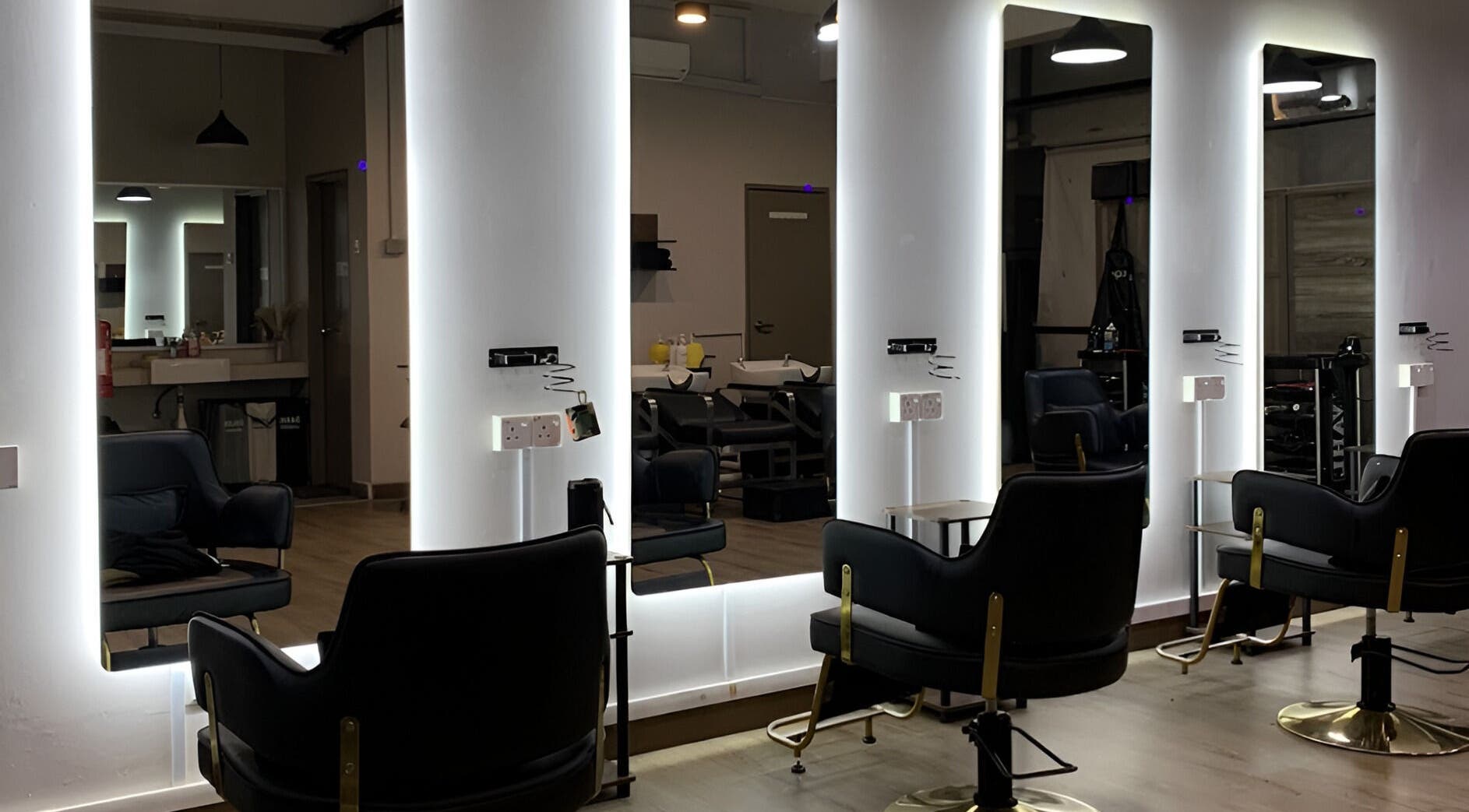 Modern styling chairs in Dee Kar Hair Salon (Lgk), Langkawi, Kedah, MY with illuminated mirrors.