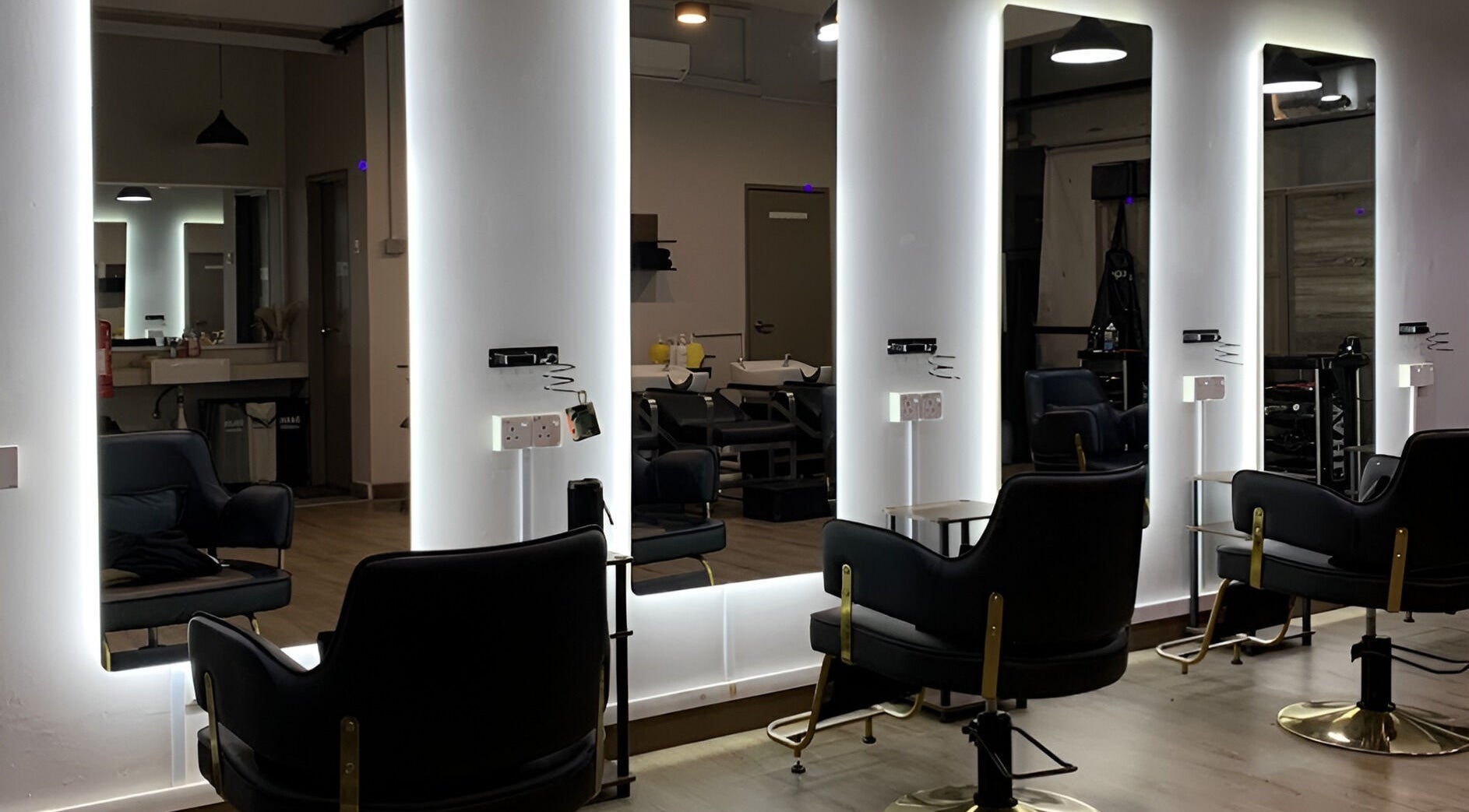 Modern styling chairs in Dee Kar Hair Salon (Lgk), Langkawi, Kedah, MY with illuminated mirrors.