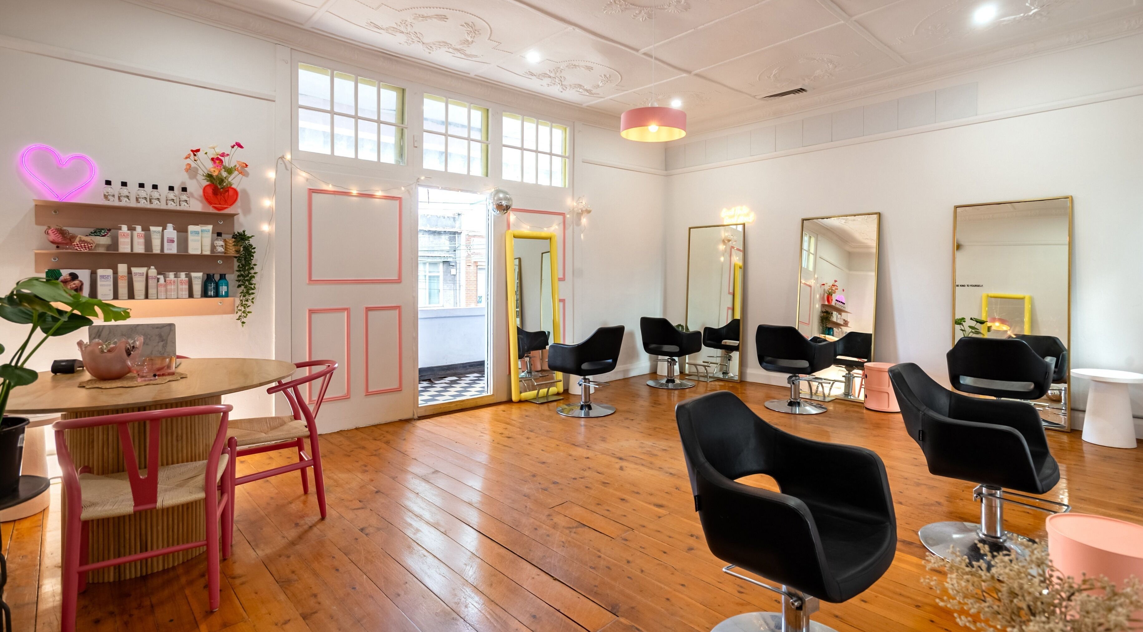 Stylish salon chairs and decor at DD+Co Hair in Marrickville, New South Wales, AU.
