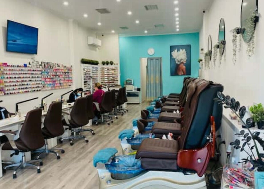 Inside Angel Nail Spa & Beauty in Glenelg, South Australia, AU with spacious, stylish pedicure and manicure stations.