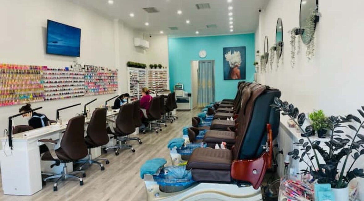 Inside Angel Nail Spa & Beauty in Glenelg, South Australia, AU with spacious, stylish pedicure and manicure stations.