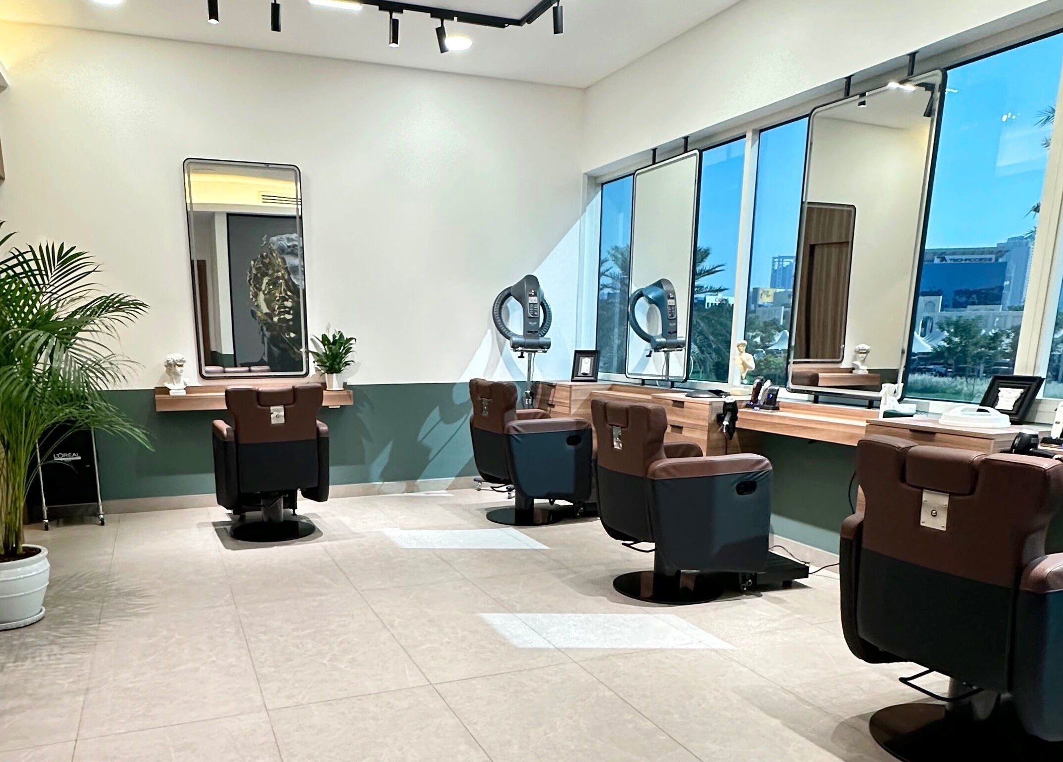 Spacious interior of The Barber Code Gents Salon in Dubai, Dubai, AE, featuring modern salon chairs and mirrors.
