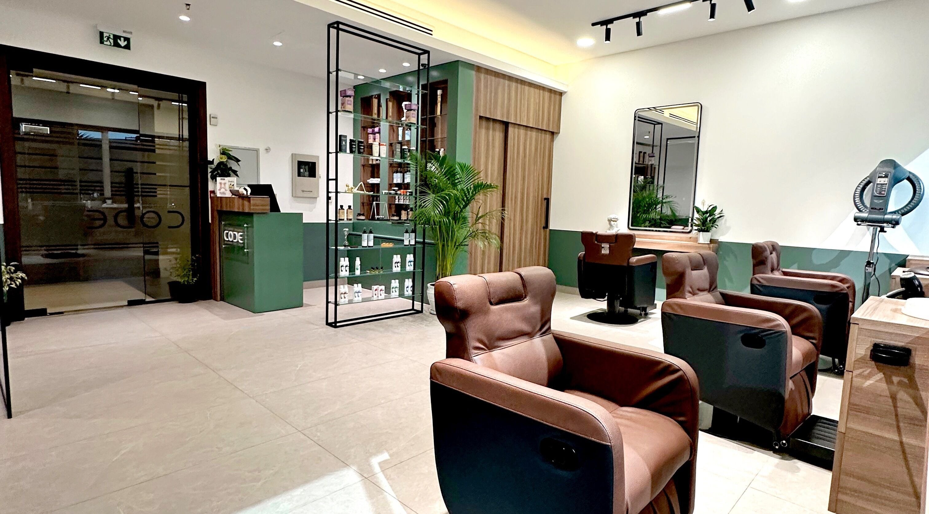 Relaxing interior of The Barber Code Gents Salon, Dubai, Dubai, AE, featuring plush chairs and modern decor.
