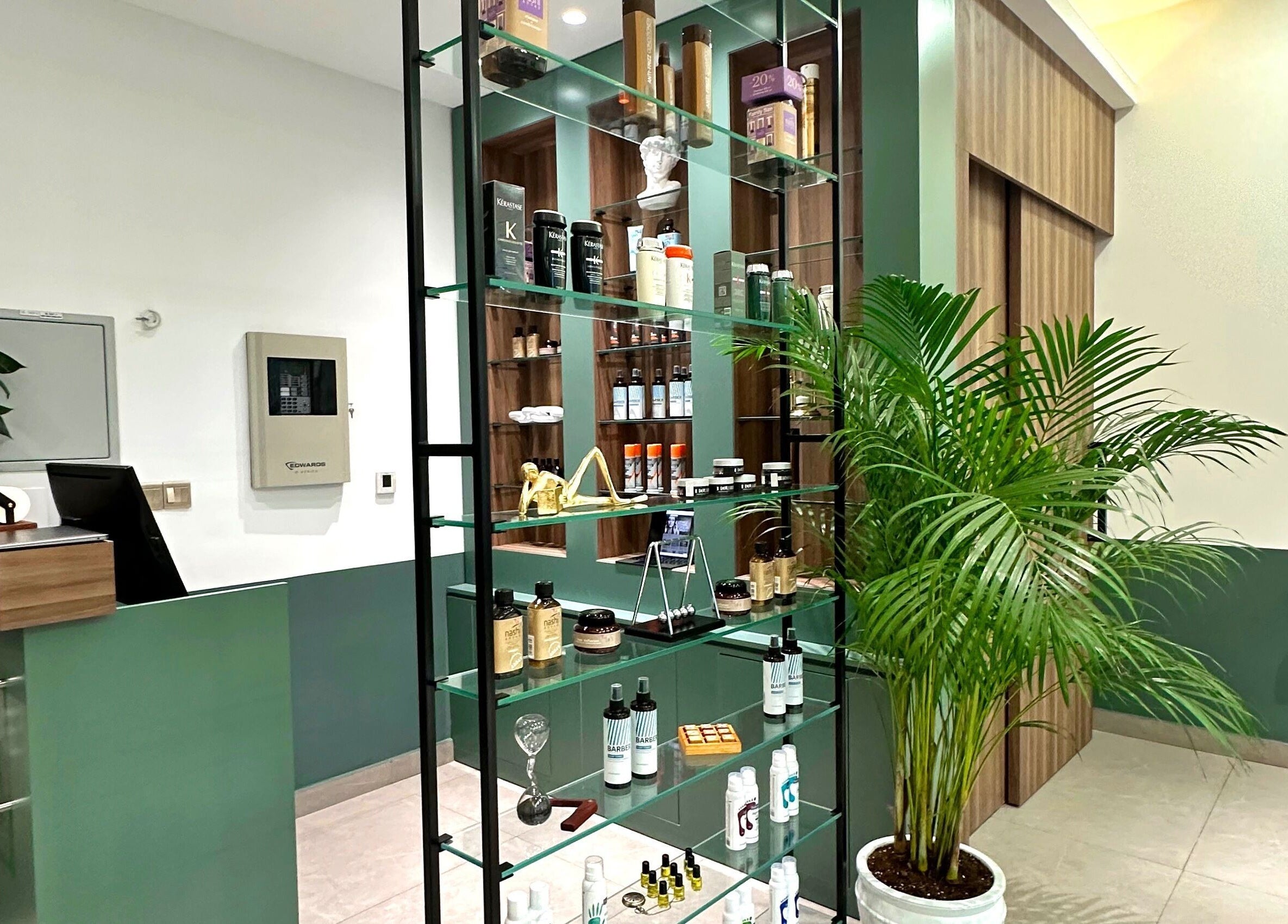 Elegant entrance of The Barber Code Gents Salon in Dubai, Dubai, AE, showcasing stylish products on display.