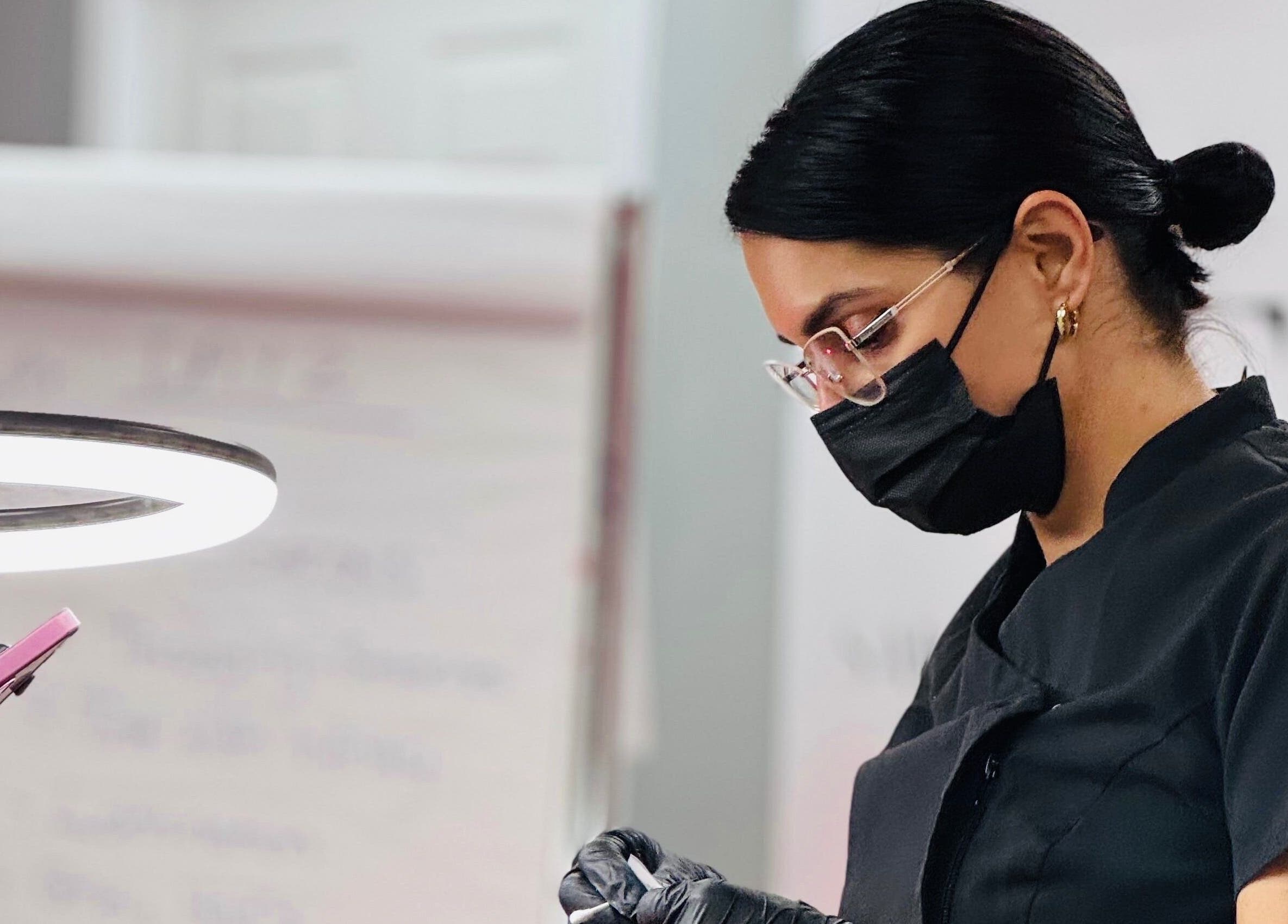 Expert beautician at The Brow Studio, Holetown, Saint James, BB, focused on detailed beauty work.