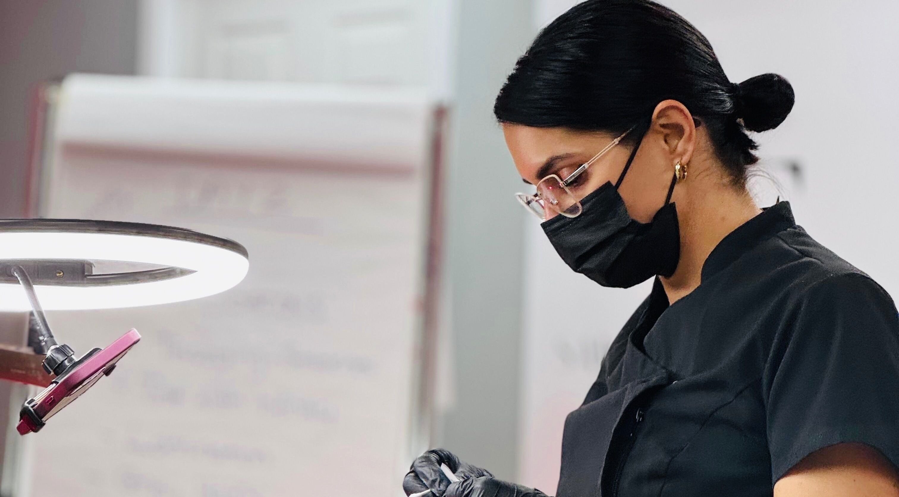 Expert beautician at The Brow Studio, Holetown, Saint James, BB, focused on detailed beauty work.