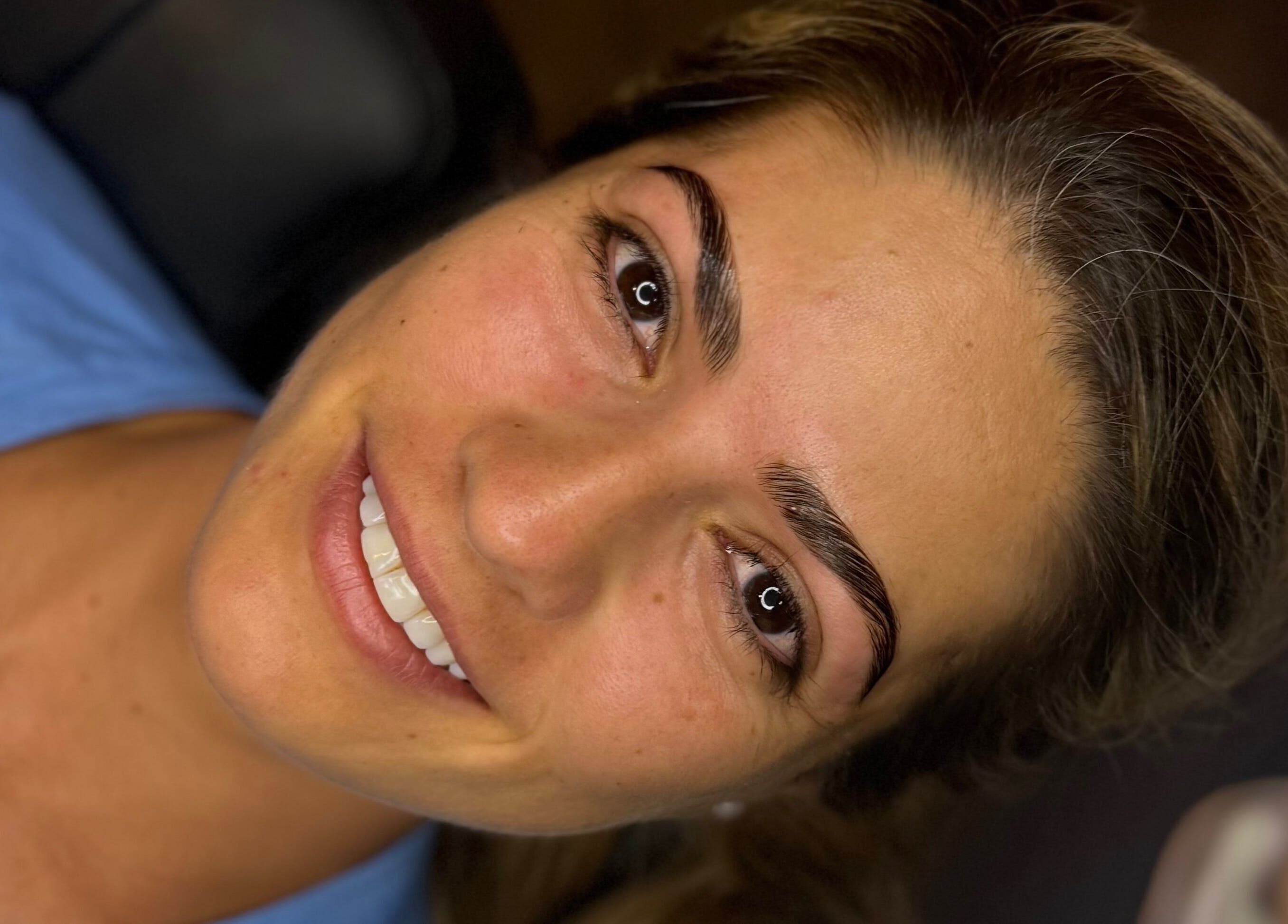 Smiling woman with perfect eyebrows at The Brow Studio, Holetown, Saint James, BB.