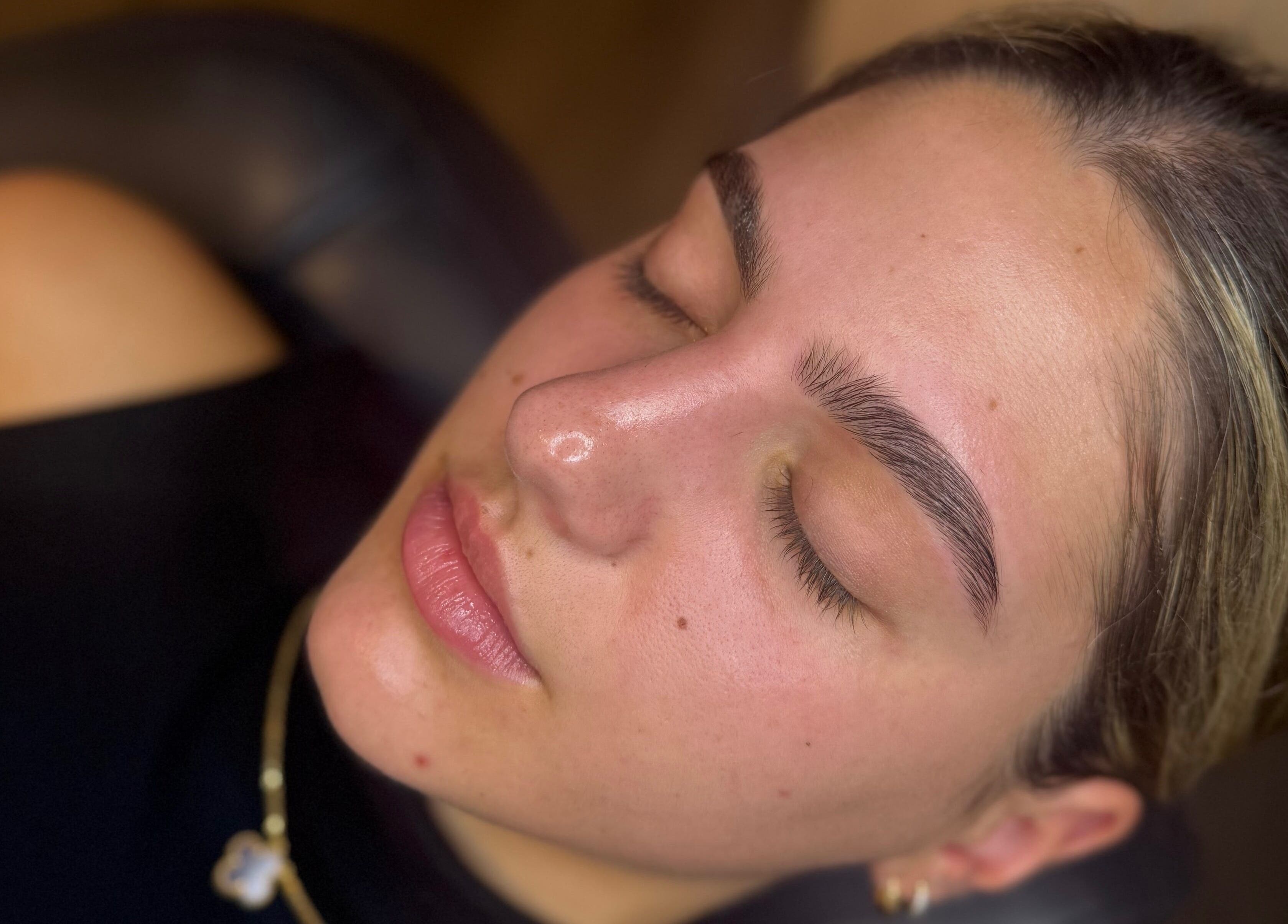 Client with perfectly groomed brows at The Brow Studio, Holetown, Saint James, BB, showcasing beauty services.