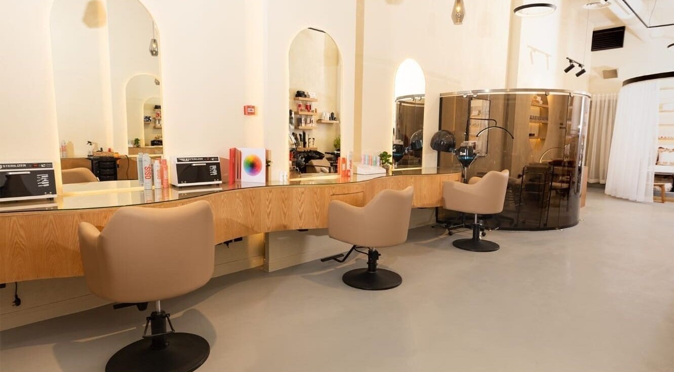 Chic interior at Memada Salon I صالون ميمادا, Riyadh, Riyadh Province, SA with stylish seating and mirrors.