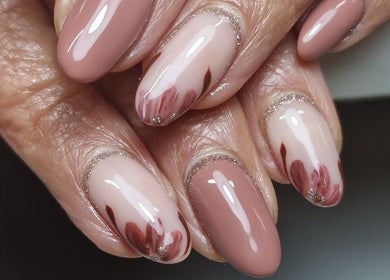 Elegant nail art with pink petals at Gels By Kana, Walsall, England, GB.
