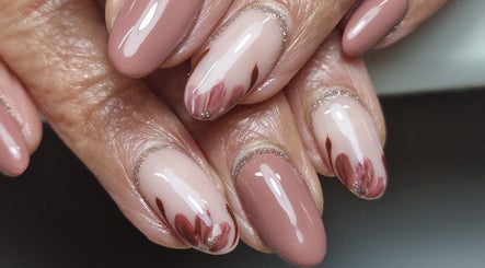 Elegant nail art with pink petals at Gels By Kana, Walsall, England, GB.