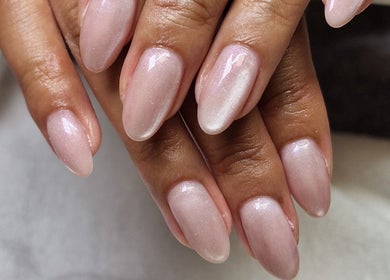Elegant pink gel nails at Gels By Kana, Walsall, England, GB showcasing intricate design.
