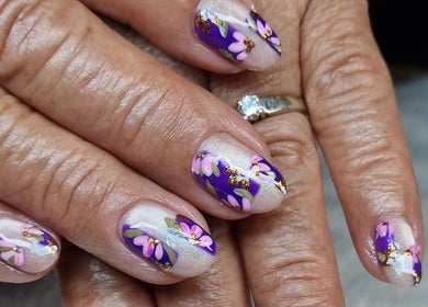 Floral nail art by Gels By Kana in Walsall, England, GB. Vibrant purple with pink flowers and gold accents.