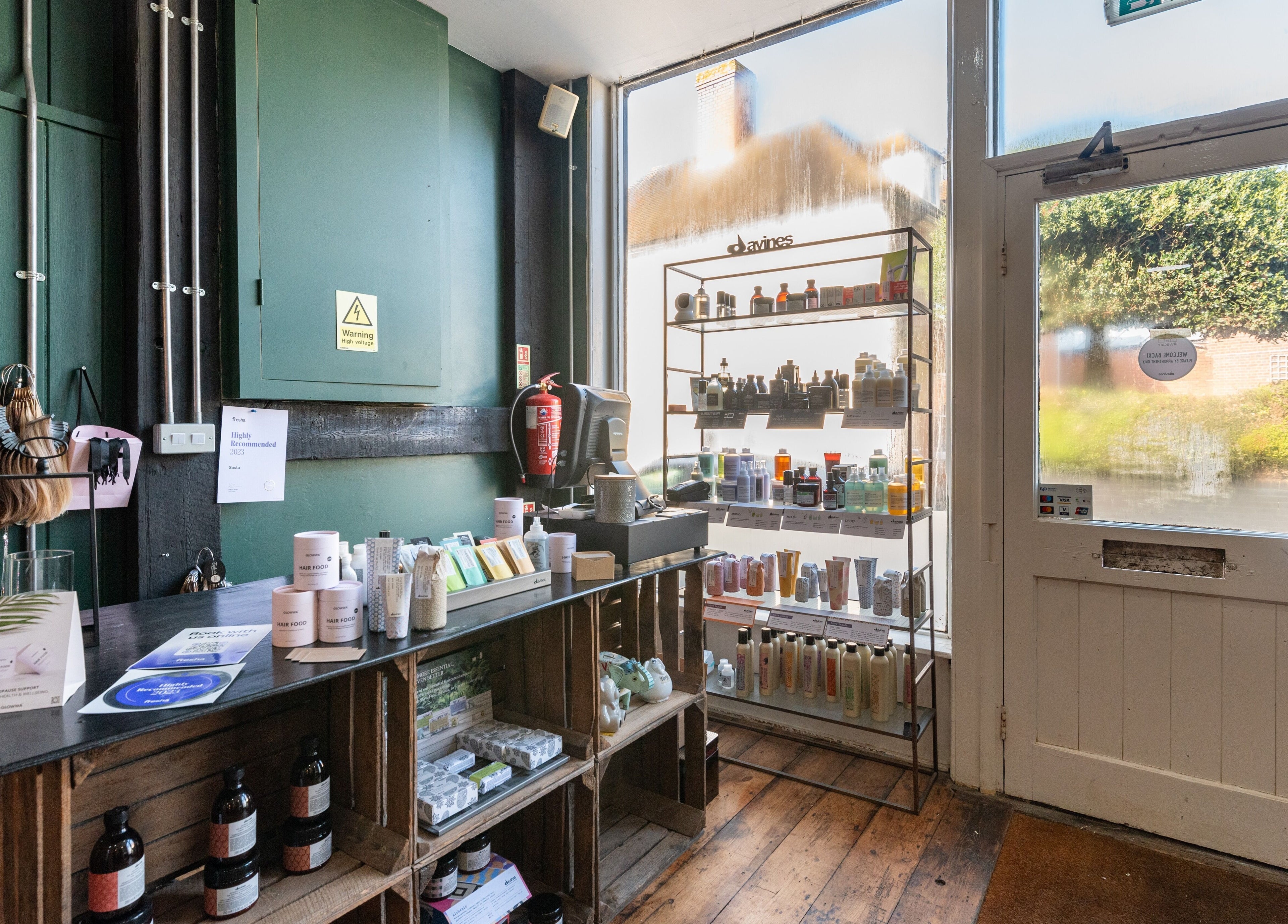 Sosta venue in Ash, England, GB, showcasing beauty products on shelves near entrance.