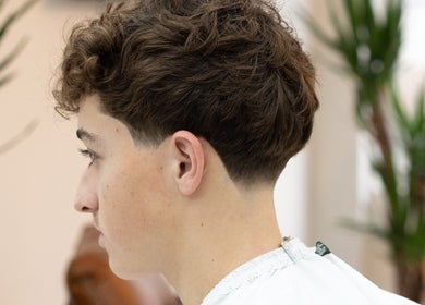 Stylish undercut haircut at ST8MNT Barbers, Gibraltar, GI, showcasing modern grooming expertise.