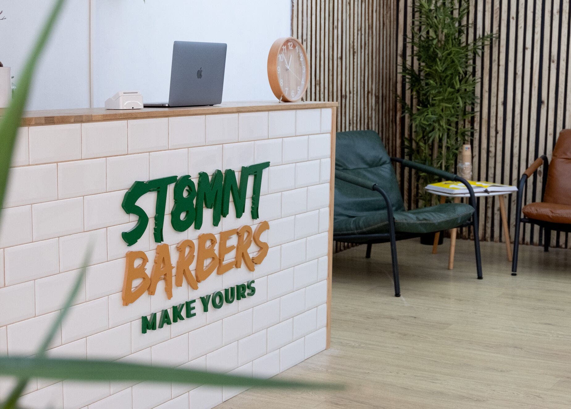 ST8MNT Barbers reception with sleek decor in Gibraltar, GI.