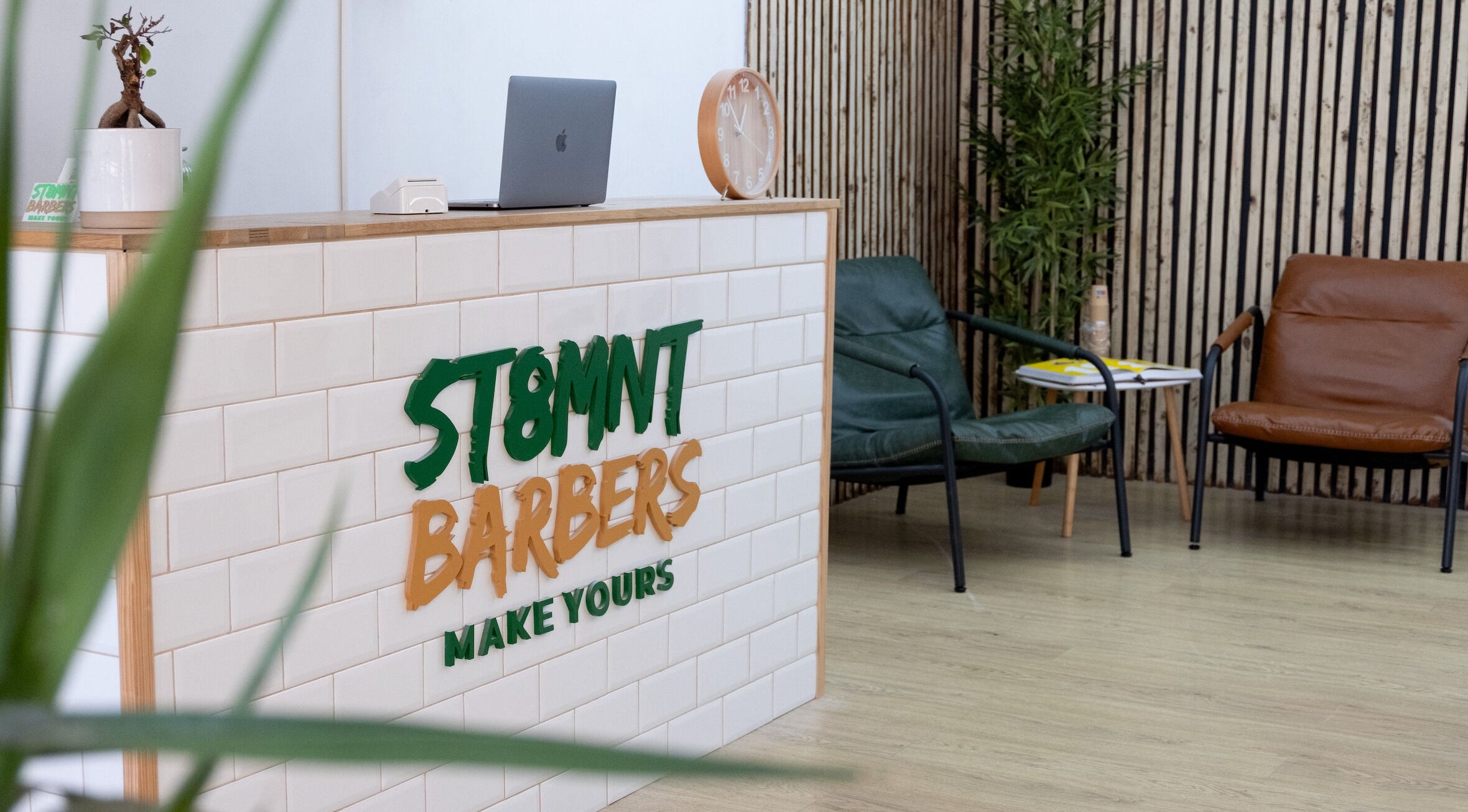 ST8MNT Barbers reception with sleek decor in Gibraltar, GI.