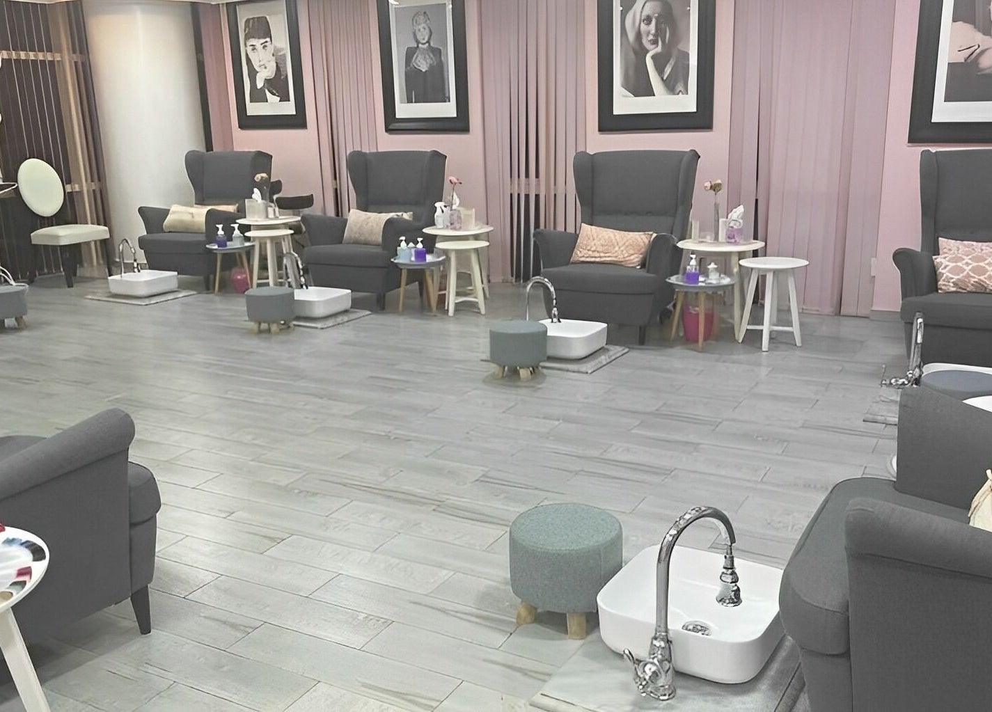 Elegant nail salon interior at Sugarcoat Nails, Abu Dhabi, AE with plush chairs and stylish decor.