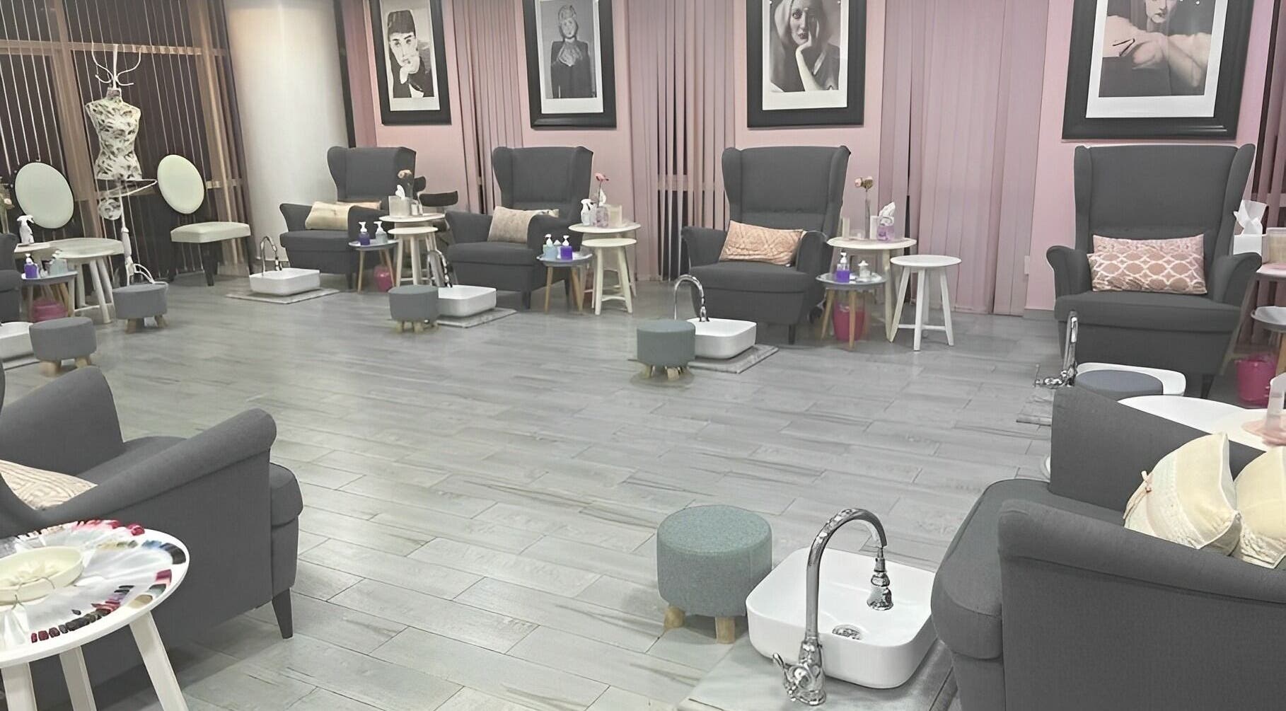 Elegant nail salon interior at Sugarcoat Nails, Abu Dhabi, AE with plush chairs and stylish decor.