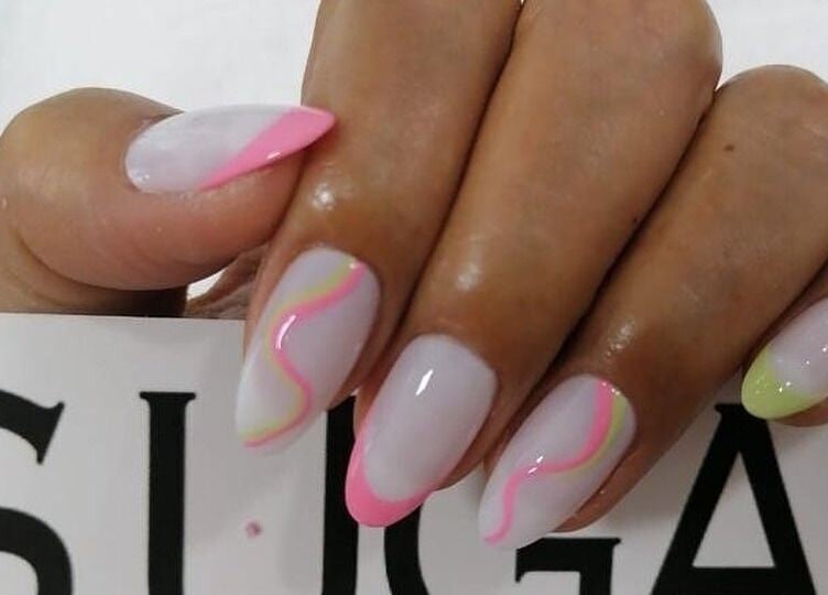 Neon swirl nail art at Sugarcoat Nails, Abu Dhabi, AE showcasing stylish manicure design.
