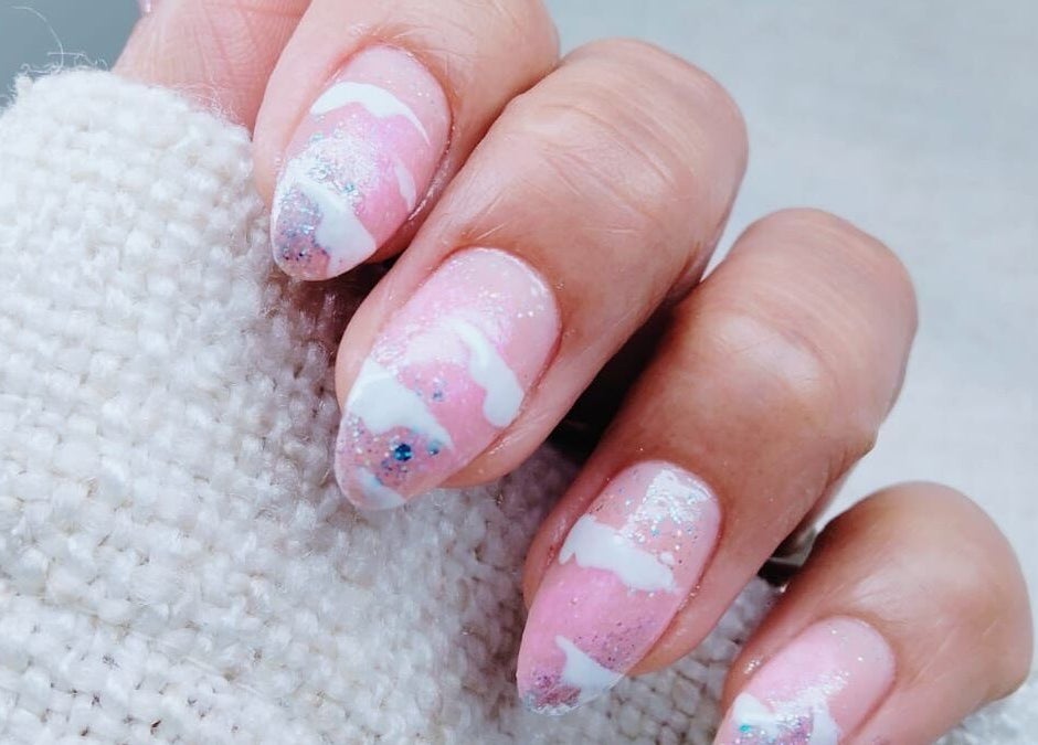 Elegant pink glitter nails with white accents at Sugarcoat Nails, Abu Dhabi, AE.