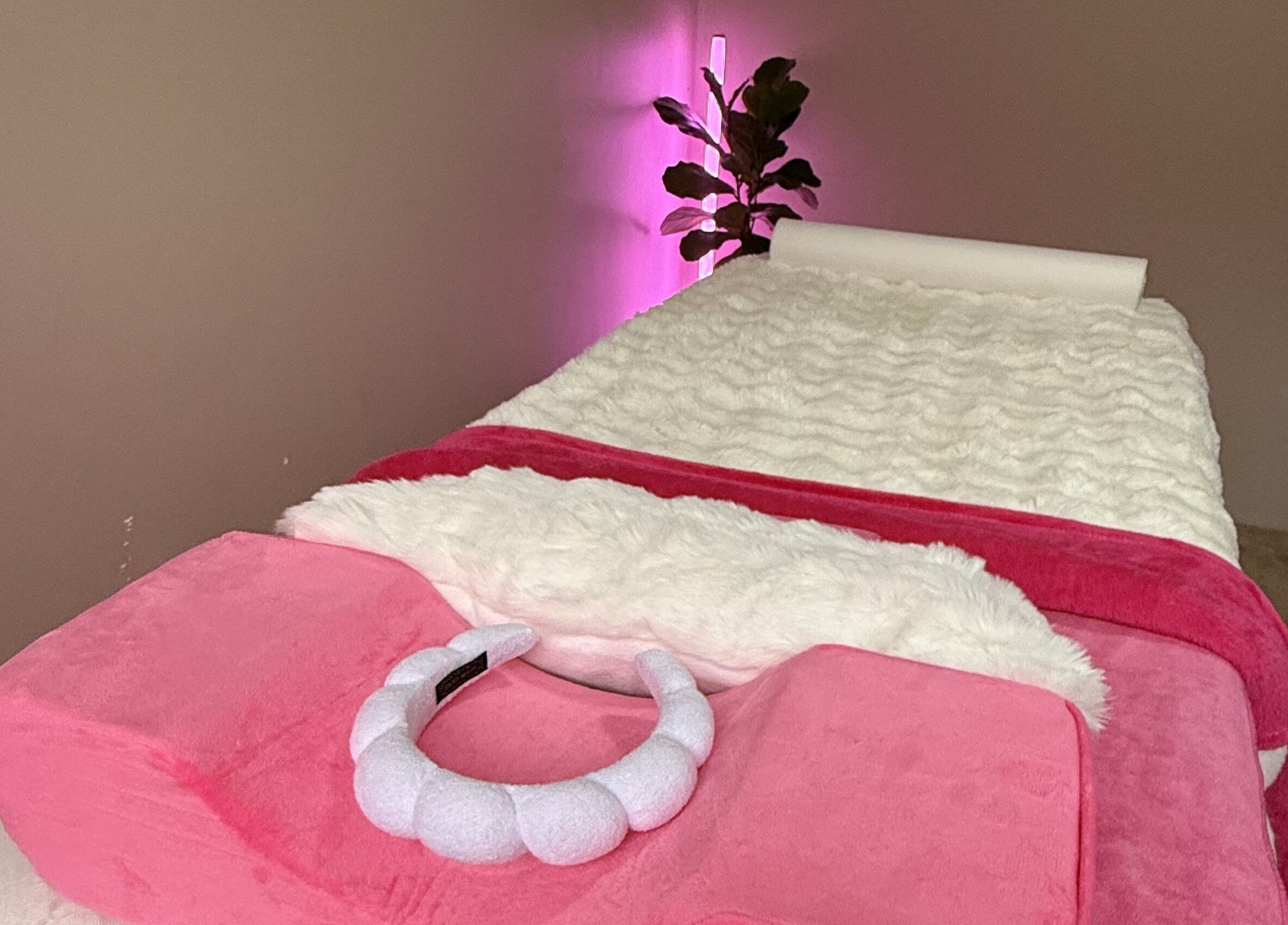 Luxurious spa bed with plush pink linens at Baddie Beauty in Wannanup, Western Australia, AU.