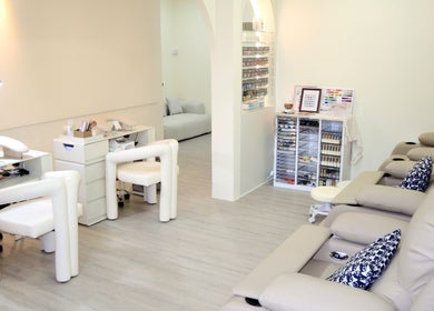 Modern and soothing interior of Elene Beauty Upper Thomson, Singapore, SG, showcasing nail and relaxation areas.
