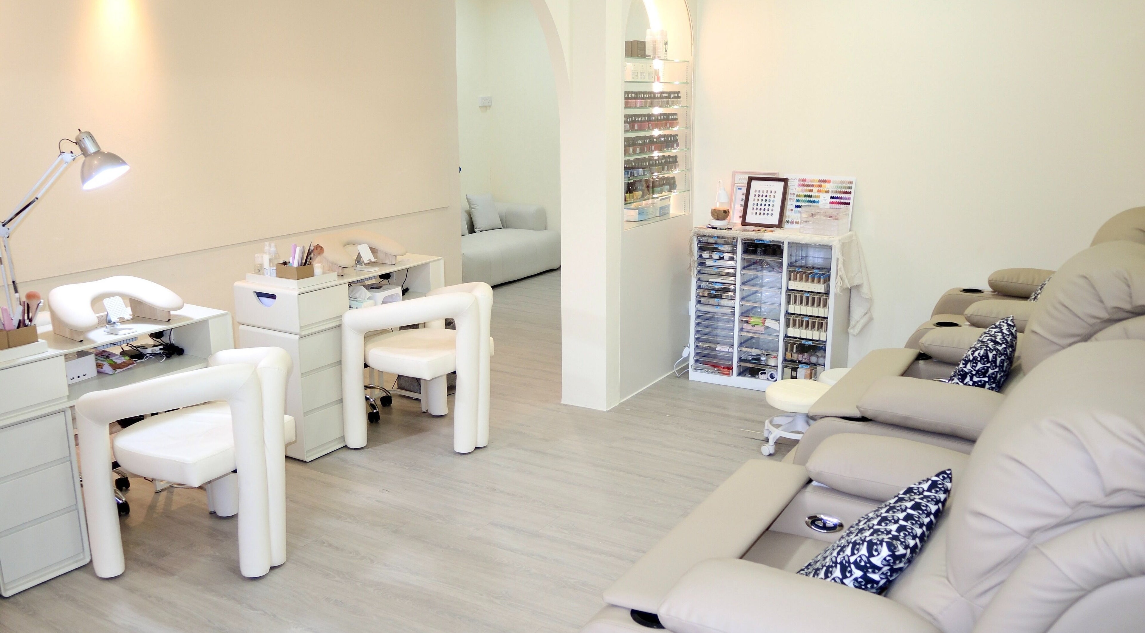 Modern and soothing interior of Elene Beauty Upper Thomson, Singapore, SG, showcasing nail and relaxation areas.