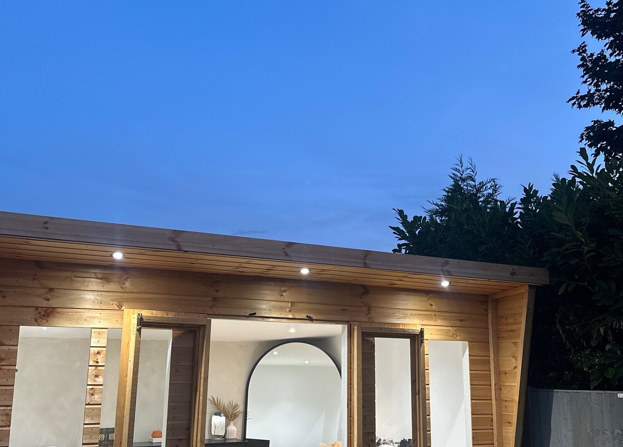 Lashed by Aimee in Nuneaton, England GB, illuminated at dusk with wooden exterior and serene ambiance.