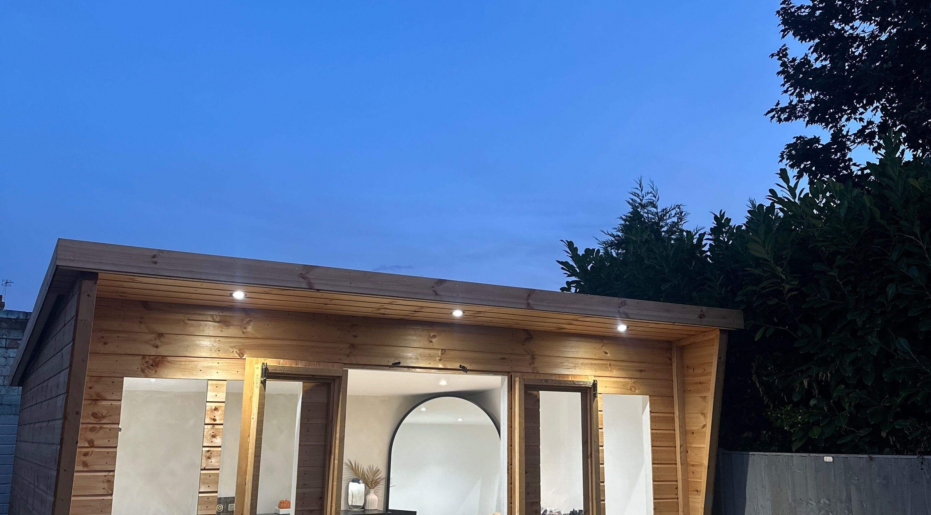 Lashed by Aimee in Nuneaton, England GB, illuminated at dusk with wooden exterior and serene ambiance.