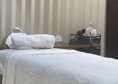Relaxing spa room at AzureRae in Bridgetown, Saint Michael, BB, featuring a cozy treatment bed.