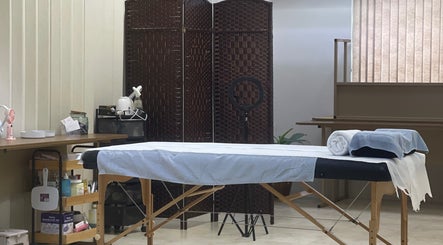 Therapy room at AzureRae, Bridgetown, Saint Michael, BB with a massage table and wellness tools.