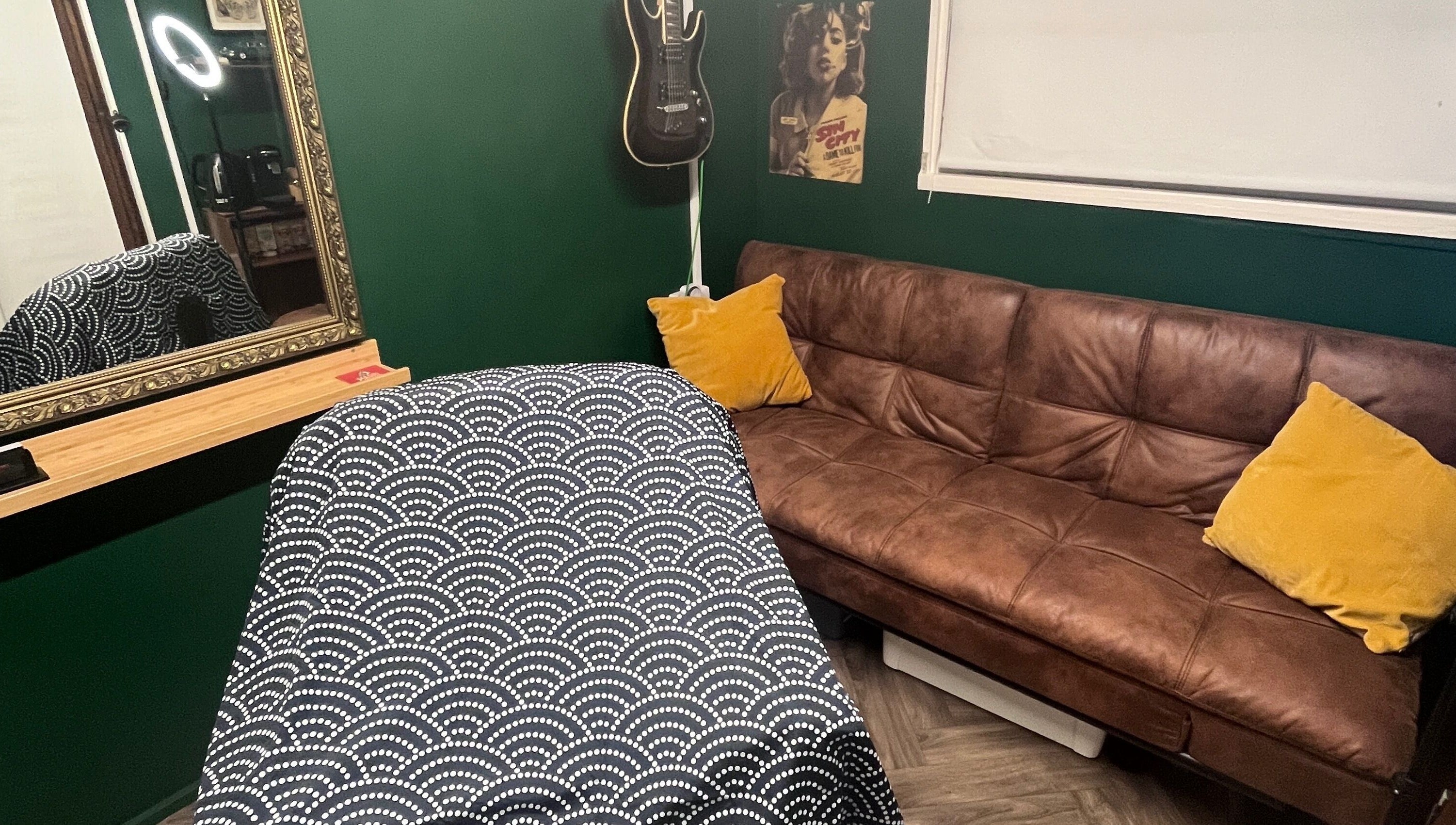 Cozy interior of Cabin Barbers in Chessington, England, GB, featuring a modern sofa and stylish decor.