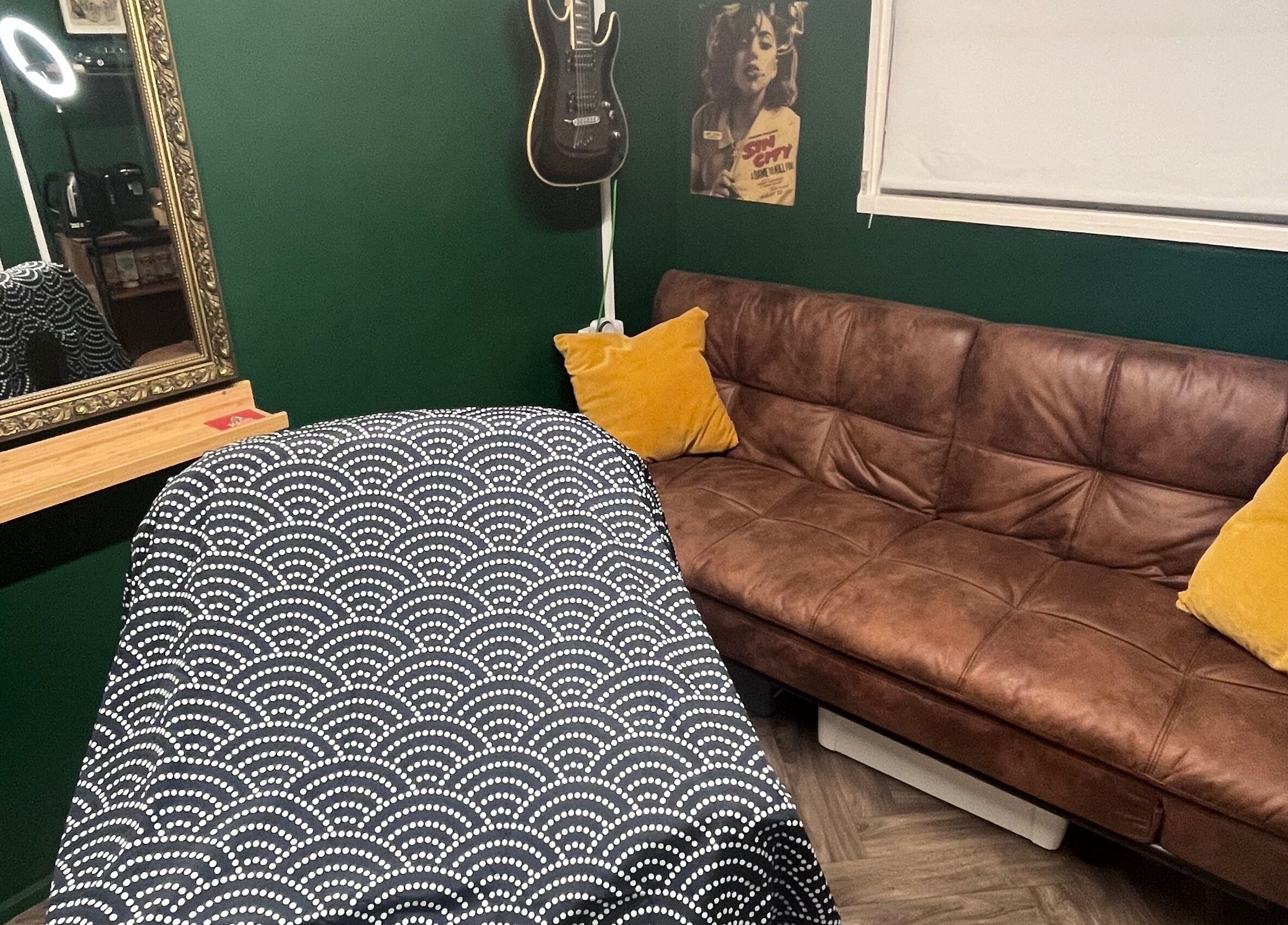 Cozy interior of Cabin Barbers in Chessington, England, GB, featuring a modern sofa and stylish decor.