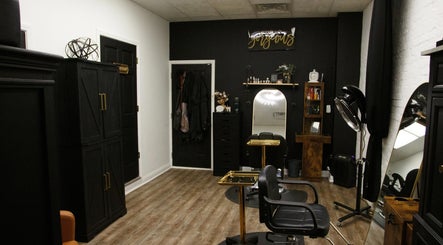 Stylish interior of Refined Beauty in Danville, Indiana, US, featuring modern salon chairs and sleek black decor.