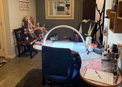 Inviting nail station at Enchanted Nails, Kelowna, British Columbia, CA, featuring chic decor and manicure tools.