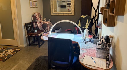 Inviting nail station at Enchanted Nails, Kelowna, British Columbia, CA, featuring chic decor and manicure tools.
