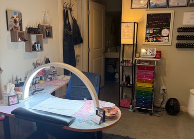 Cozy nail studio at Enchanted Nails in Kelowna, British Columbia, CA with a colorful and inviting setup.