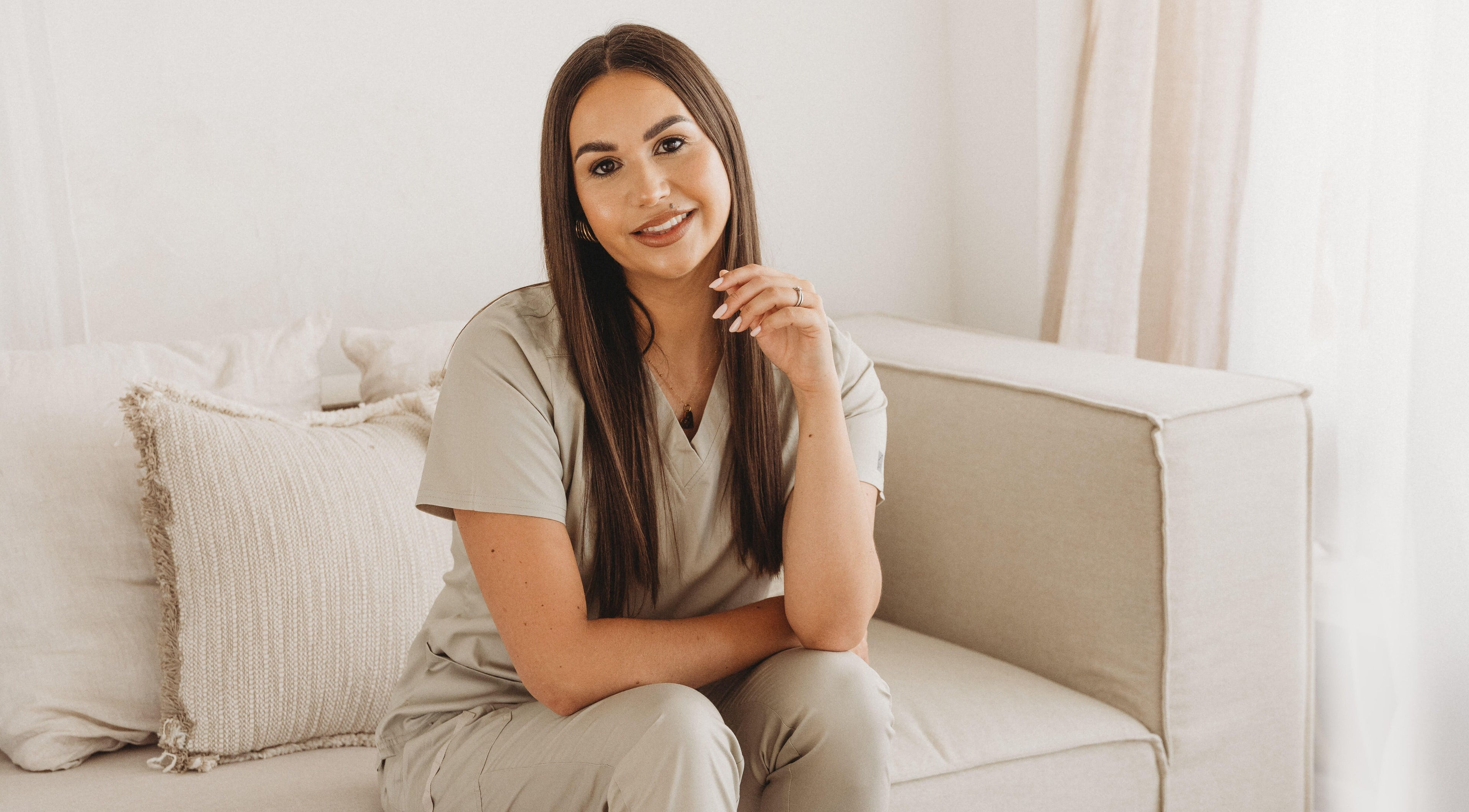 Professional at Cure The Nail Studio in Oswestry, England, GB seated in a serene, cozy setting.