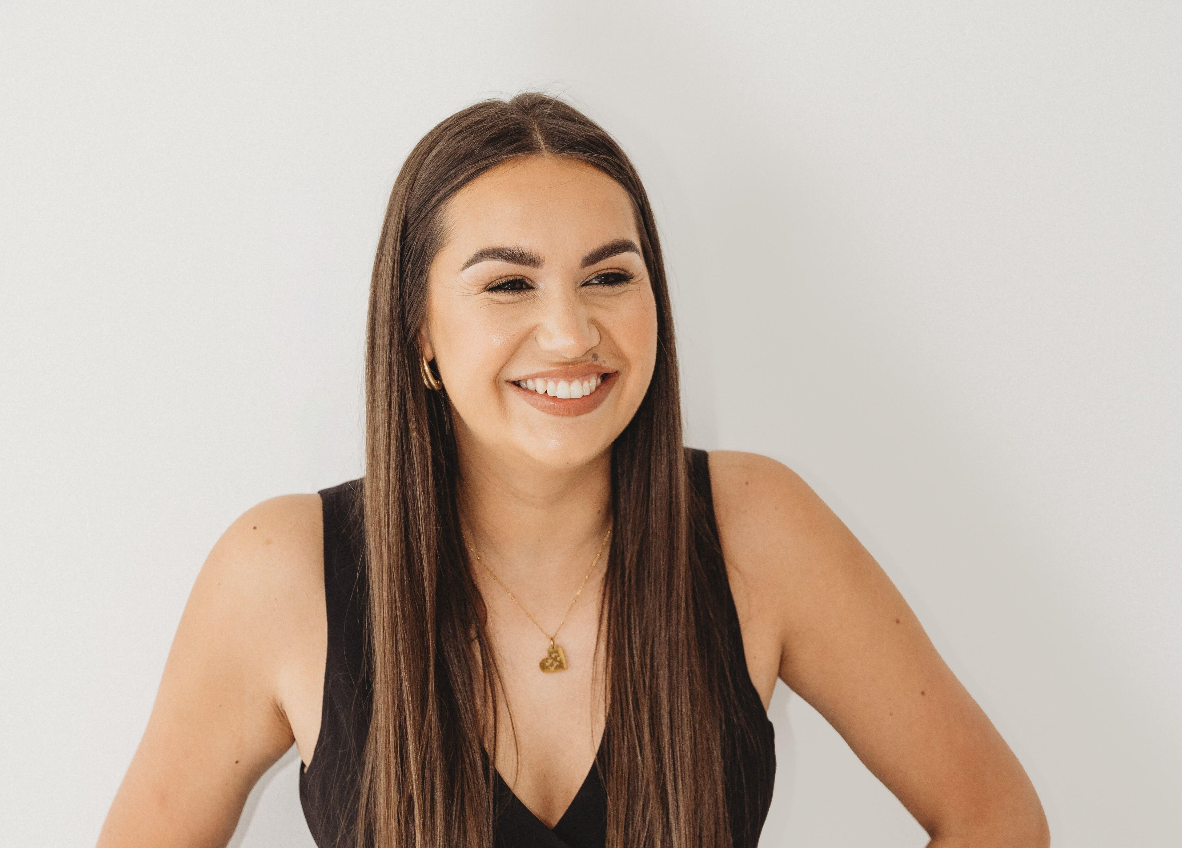 Smiling person at Cure The Nail Studio, Oswestry, England, GB showing satisfaction and wellness.