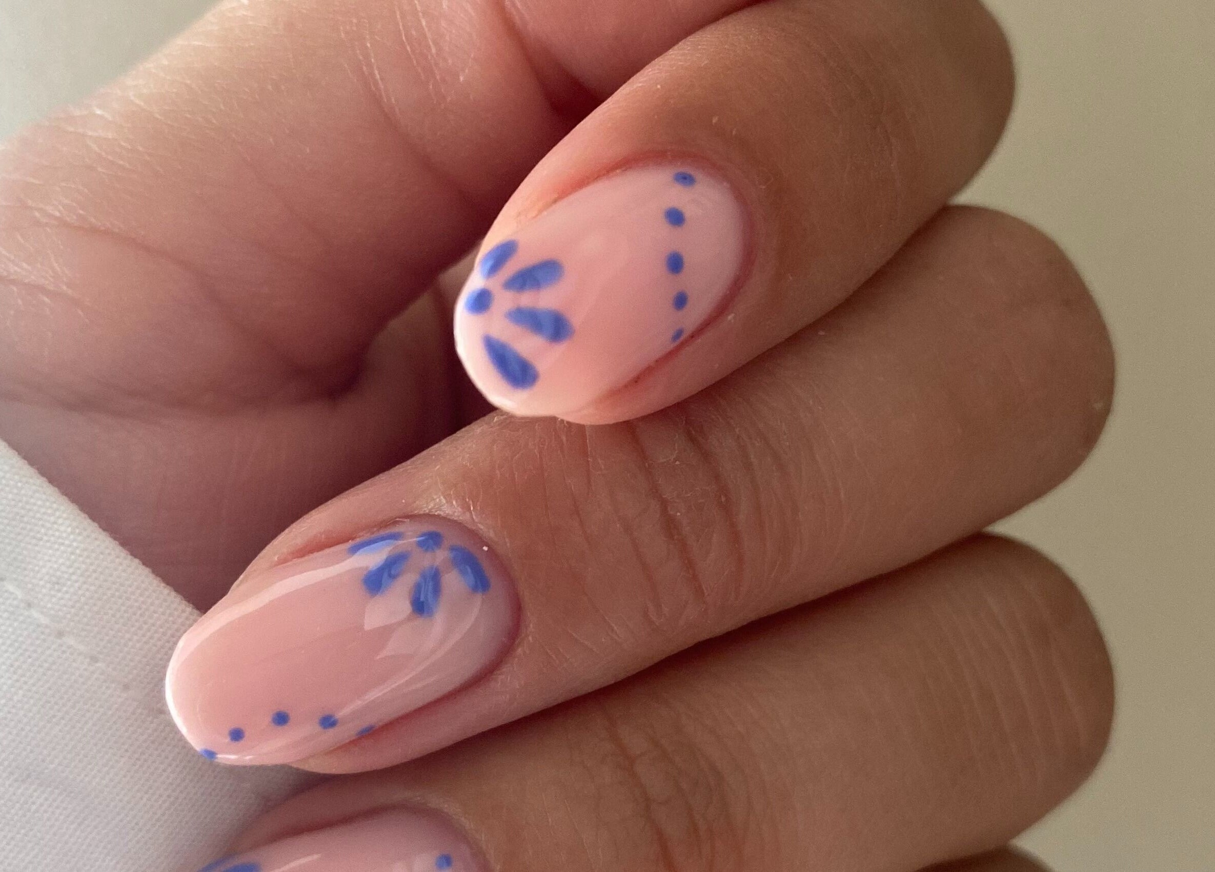 Elegant blue floral nail art at Cure The Nail Studio, Oswestry, England, GB.