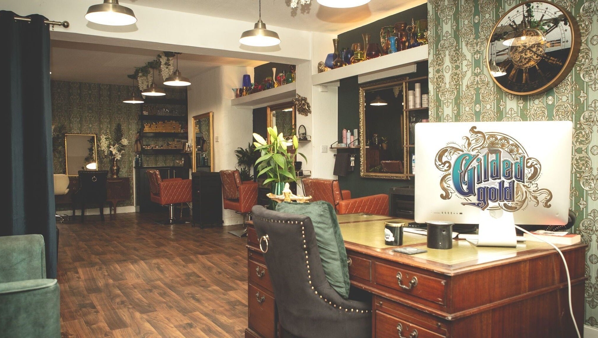 Chic interior of Gilded Gold Design House in Carlisle, England, GB with elegant decor and luxurious seating.