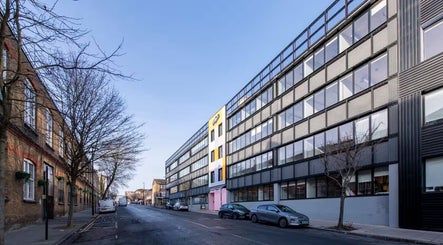 Street view of ZERO81 Hair Studio - Caledonian Road, London, England, GB with modern architecture.