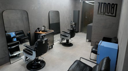 Interior of ZERO81 Hair Studio - Liverpool Street in London, England, GB with stylish barber chairs.