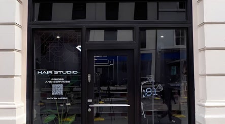 ZERO81 Hair Studio - Liverpool Street front entrance, London, England, GB, showcasing modern door and signage.