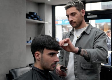 Expert stylist at ZERO81 Hair Studio - Liverpool Street, London, England, GB working on a modern haircut.